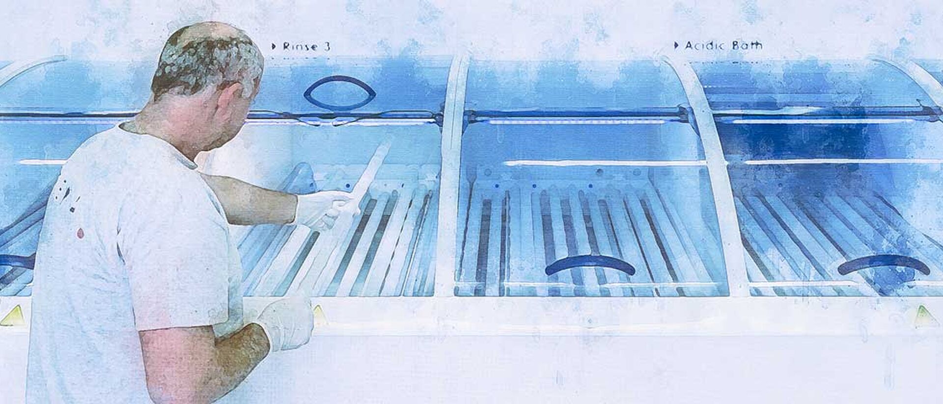 RENA employee working on a machine