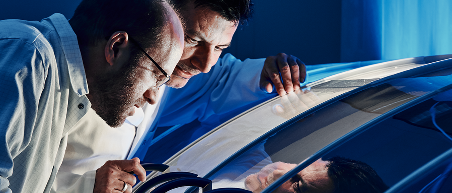 Engineers looking at a machine