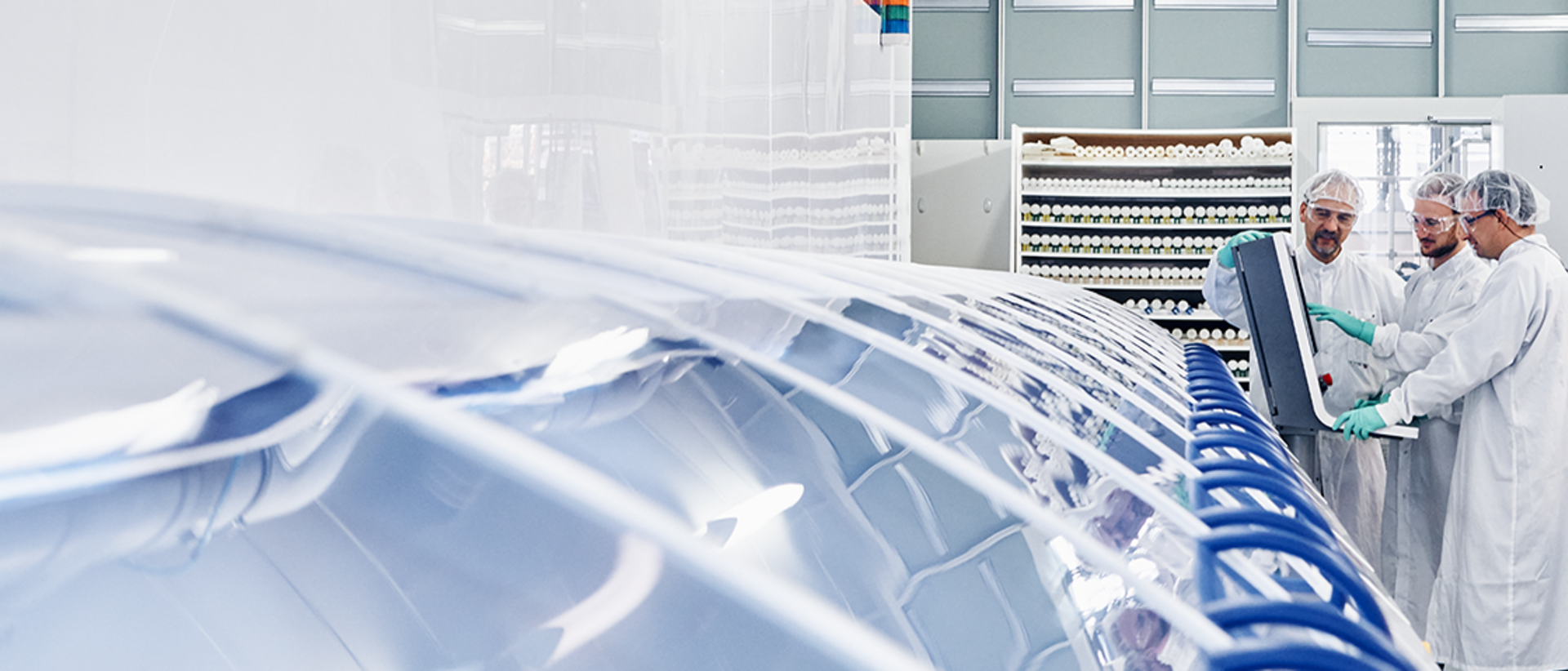 RENA employees working on a machine