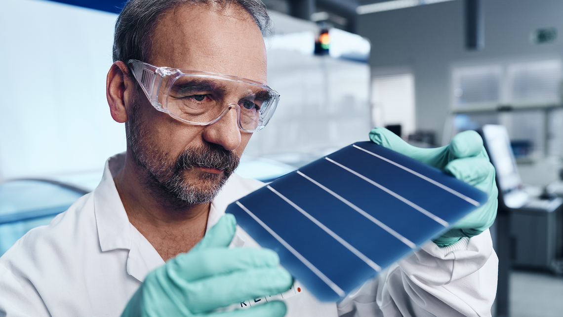 Blue wafer in the background a white machine