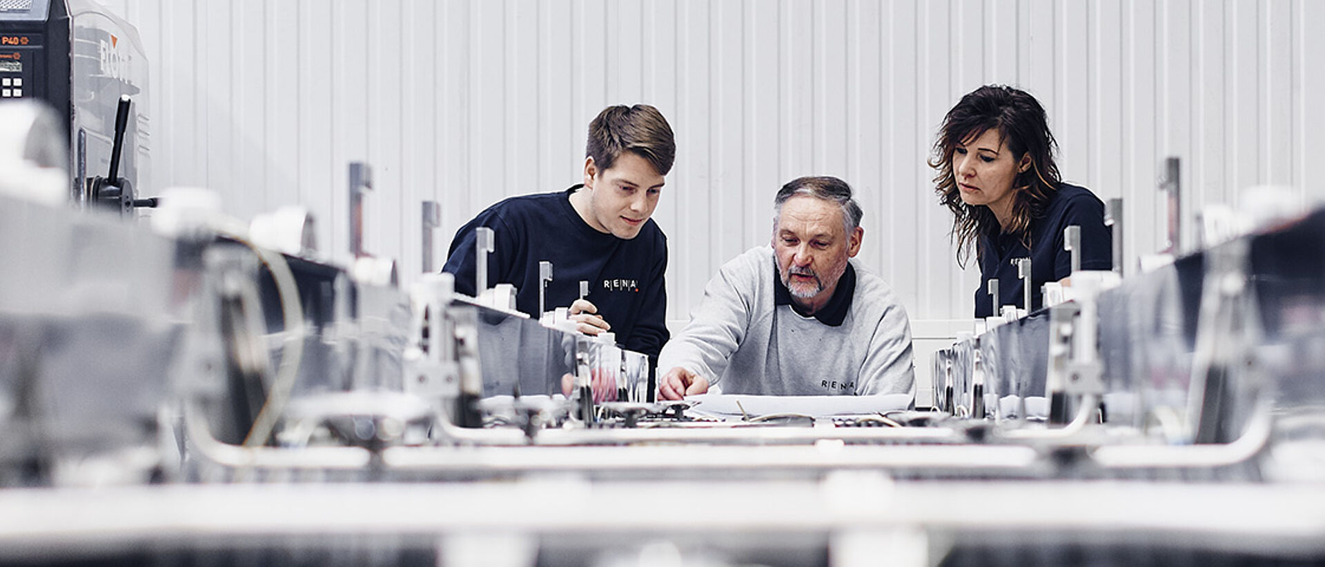 three employees discussing over a document